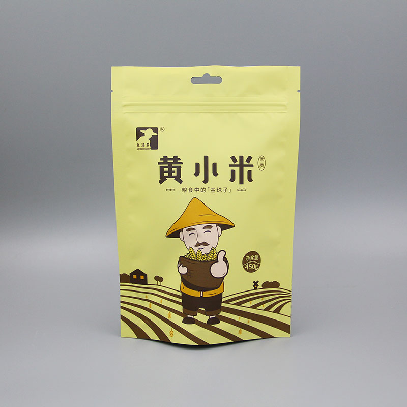 黄小米自立拉链带孔包装袋